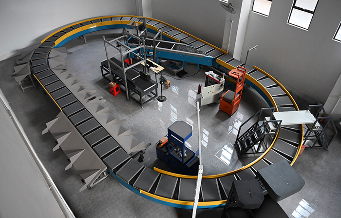 環型交叉帶分揀機的工作原理、特點及應用